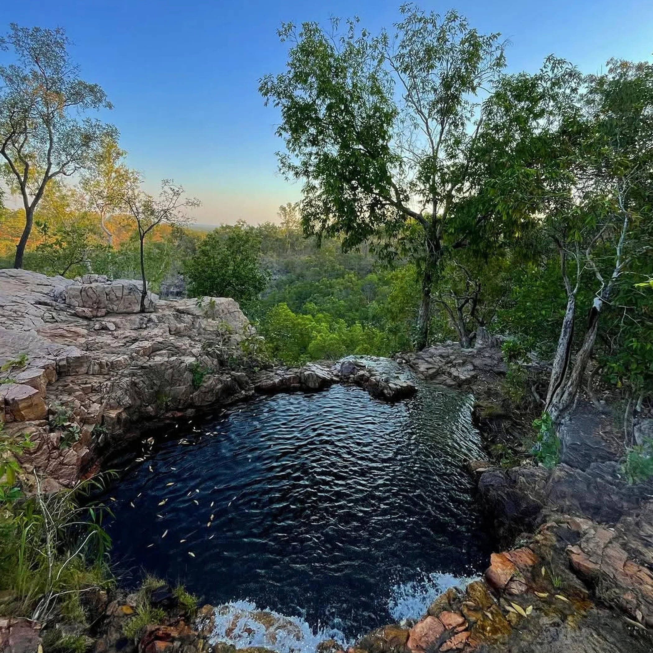 wangi falls surrounded by lush greenery