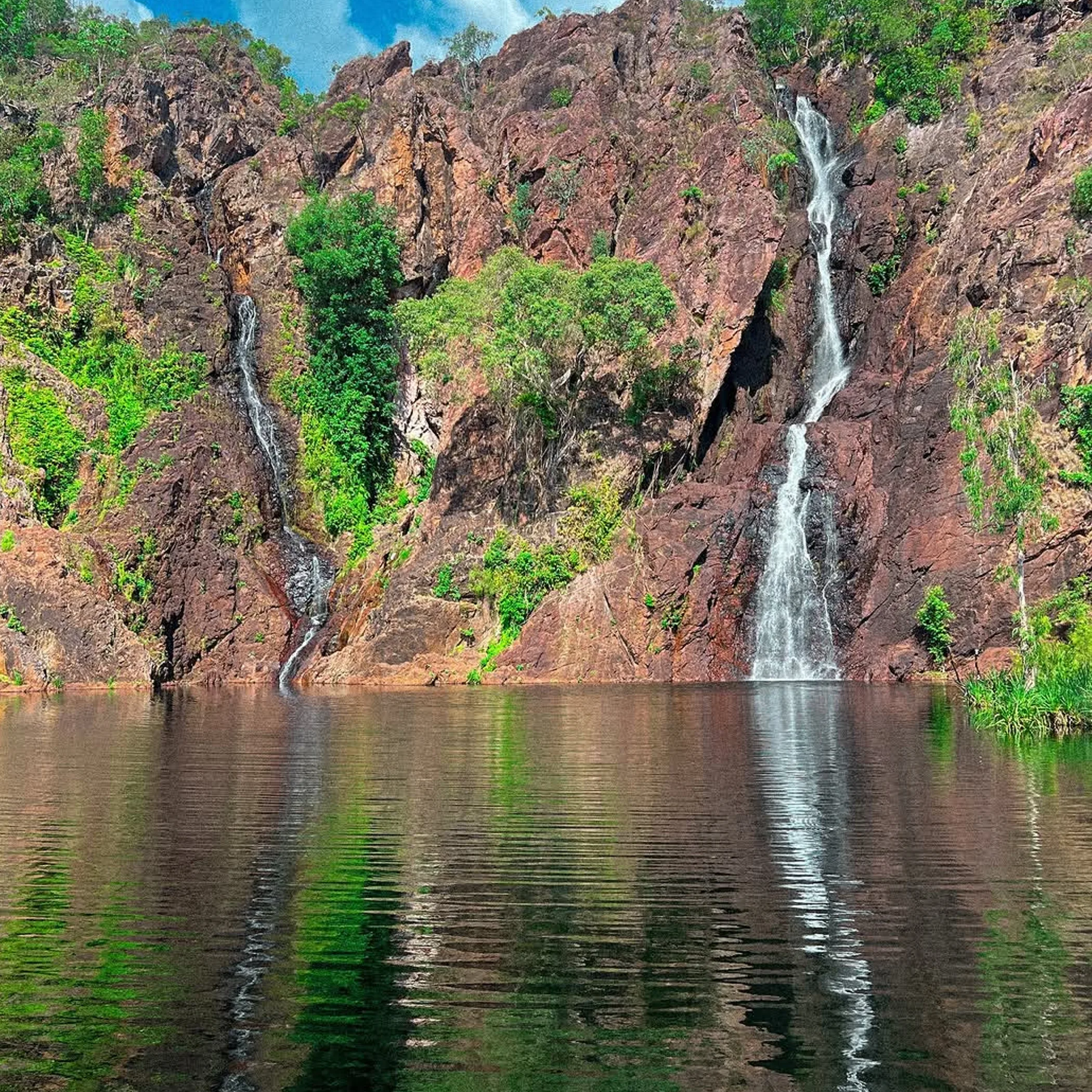 wangi falls cascading water rocks trees